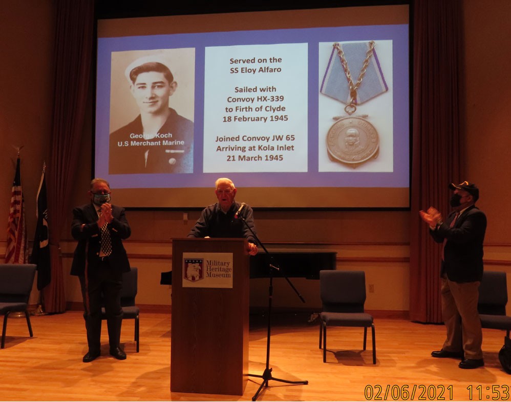 WWII MM Veteran George Koch at the podium to receive recognition